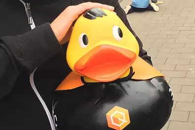 5th Wuppertal Duck Race Babtec employee holds the Babtec duck from the 5th Wuppertal Duck Race in his arms