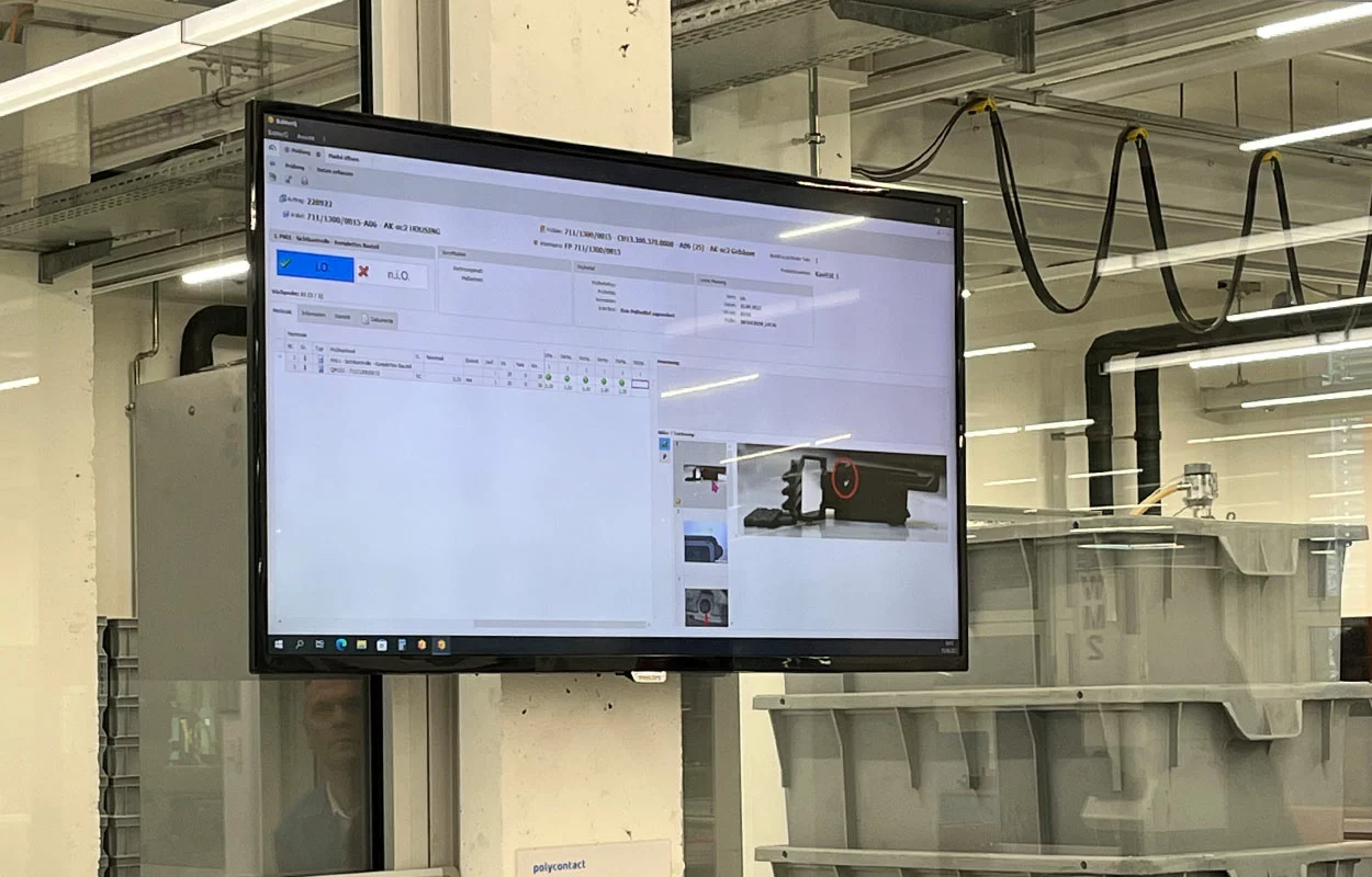Monitor in production hall of Polycontact AG