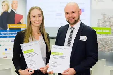Babtec Germany Scholarship at the HTW Dresden Two people each holding a certificate in their hands